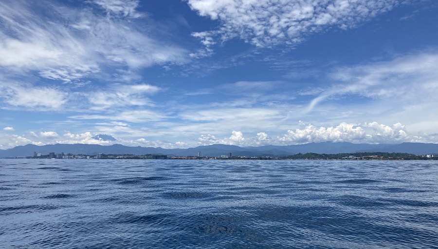 Kota Kinabalu from the sea. Photo © Gina Nichol.